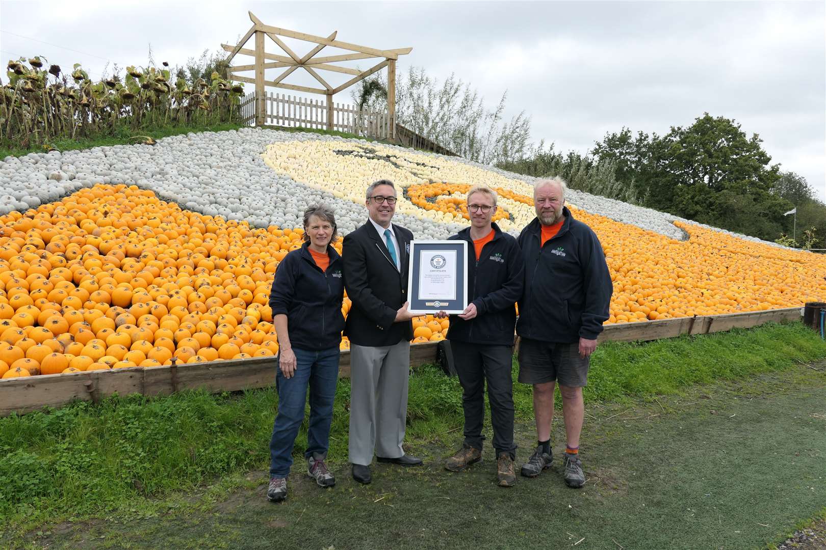 The Nelson family receiving their Guinness World Records certificate (Guinness World Records/PA)