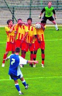 Luke Rooney's free-kick against Calais is blocked