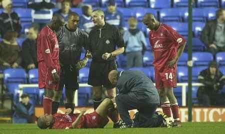 CONCERNING SIGHT: Gillingham's Chris Hope goes down with a knee injury in last night's match. Picture: GRANT FALVEY