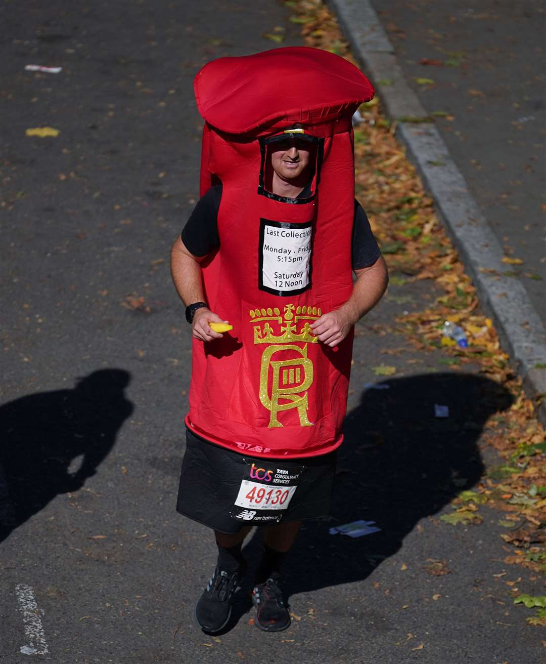 A runner dressed as a red postbox during the London Marathon (Yui Mok/PA)