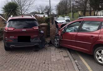 Police hunt five men after driveway crash