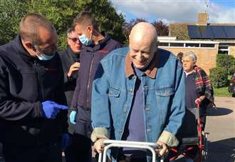 Emotional moment fire crews help terminally-ill man get outside