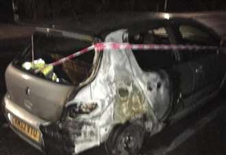 Police wake couple after car 'set alight'