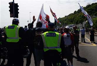 Four charged after immigration march