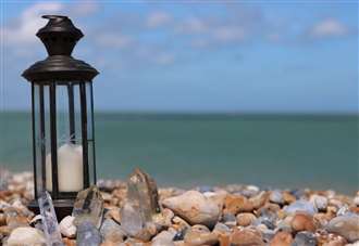 Lantern gathering on beach to mark midsummer