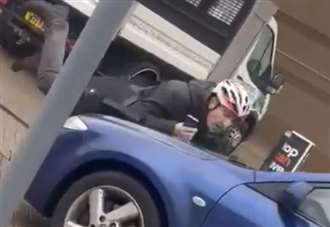 Moment car drives into cyclist at B&Q caught on camera