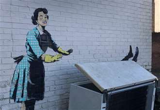Work begins to remove Banksy from side of house