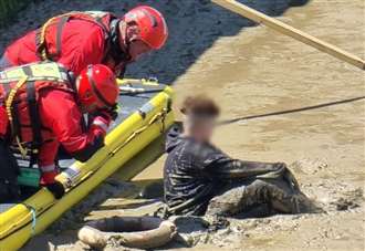 Teenager rescued after getting stuck in mud