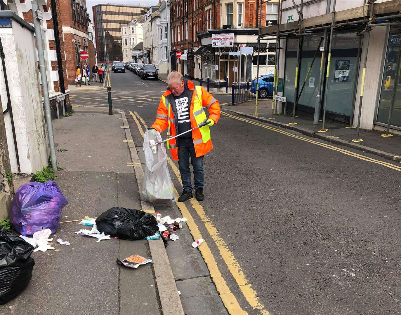 Volunteers are keeping away from each other as they work