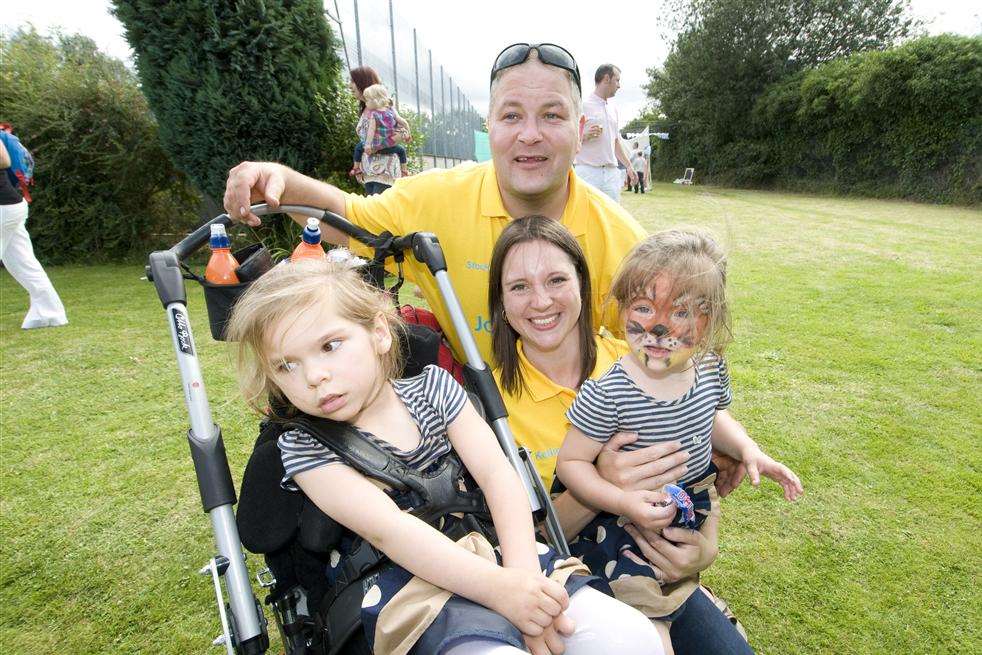 Noel Stockdale, Kellie Humphrey, Lola and sister Ellie at a fundraising event at Woodcombe Sports and Social Club