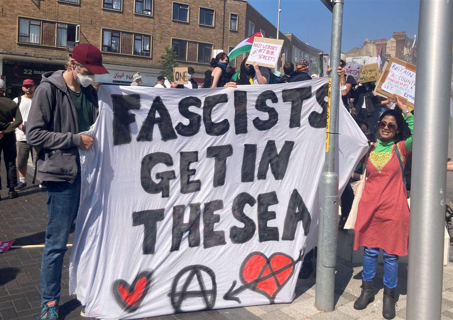 One sign on display at the counter-protests in Dover's Market Square reads: "FASCISTS GET IN THE SEA"