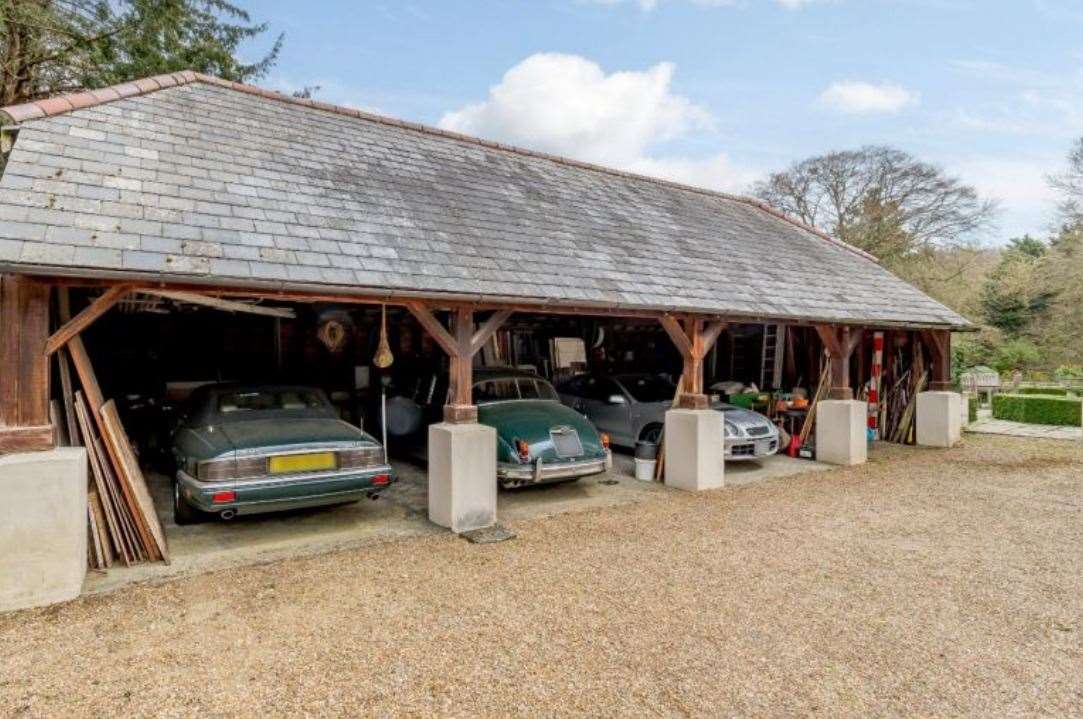 There's plenty of space to park your cars - famous or not - in the four-bay barn garage. Picture: Strutt and Parker