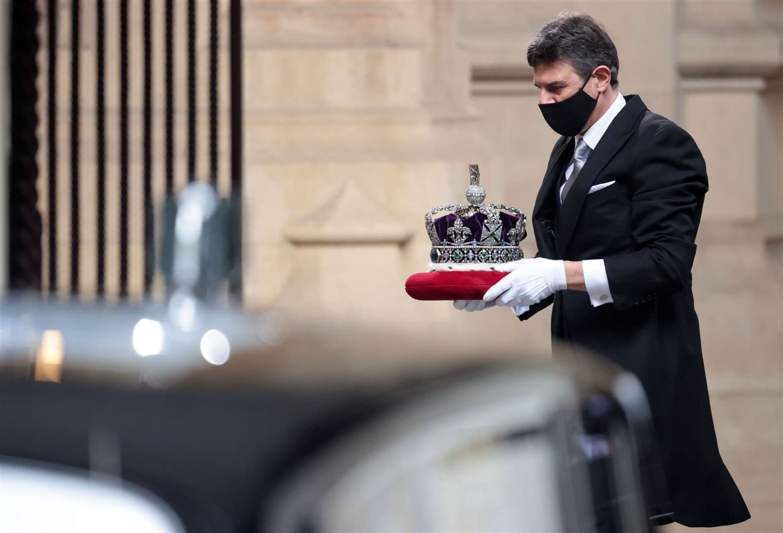 The crown is taken to the Palace of Westminster (Hannah McKay/PA)