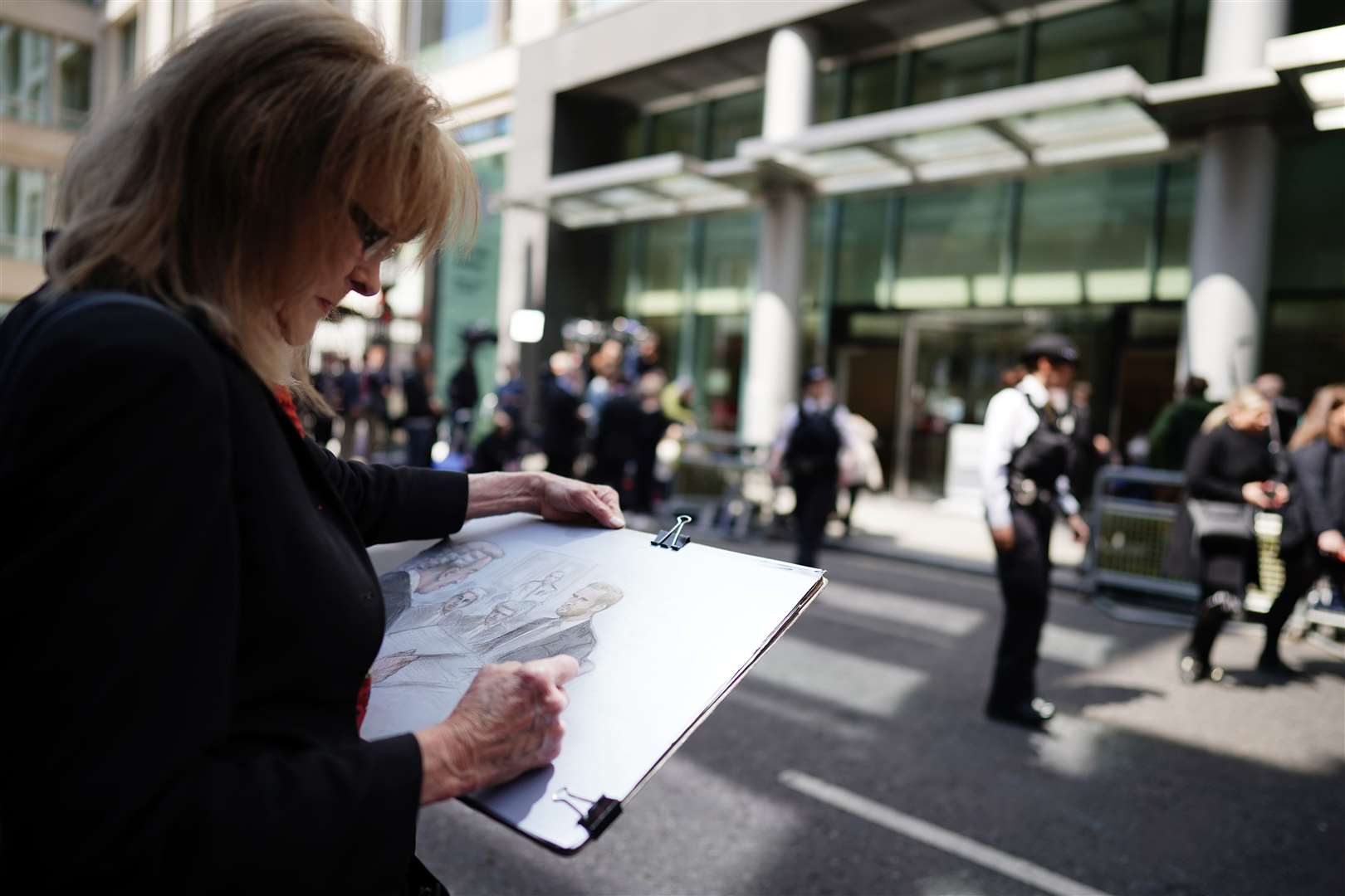 Court artist Elizabeth Cook works on her drawing of the Duke of Sussex giving evidence (Aaron Chown/PA)