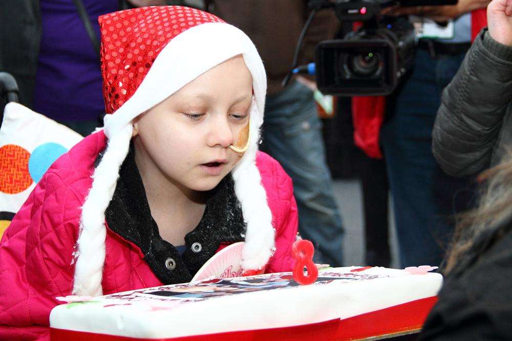 Stacey Mowle blows the candle out on her birthday cake at the Gravesend Bake Off