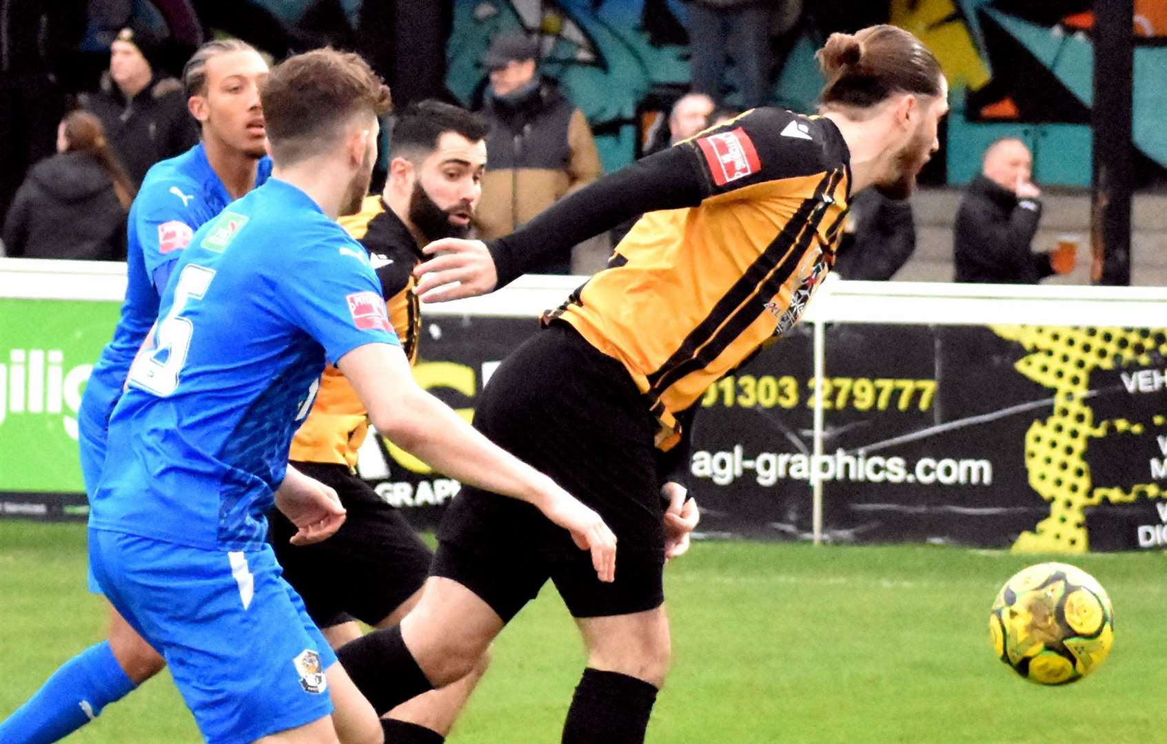 Folkestone forward Tom Derry tries to head the ball on. Picture: Randolph File