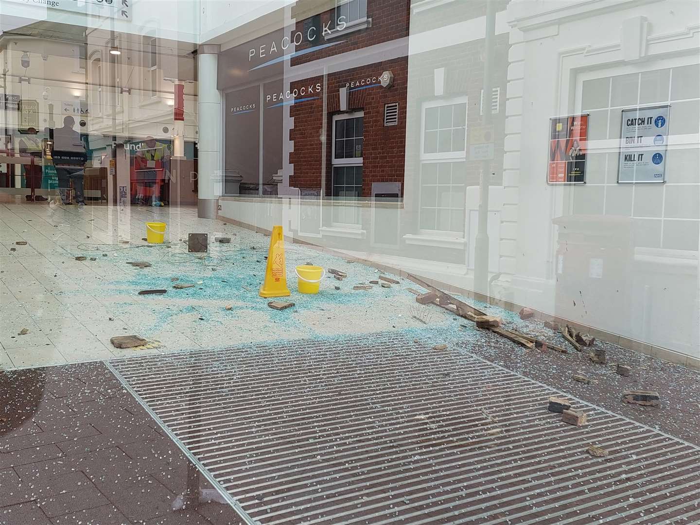 Smashed glass in Ashford's County Square shopping centre
