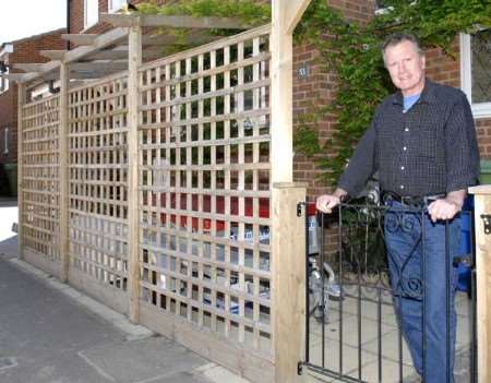 Derek Hatton next to the offending structure. Picture: Gerry Whittaker