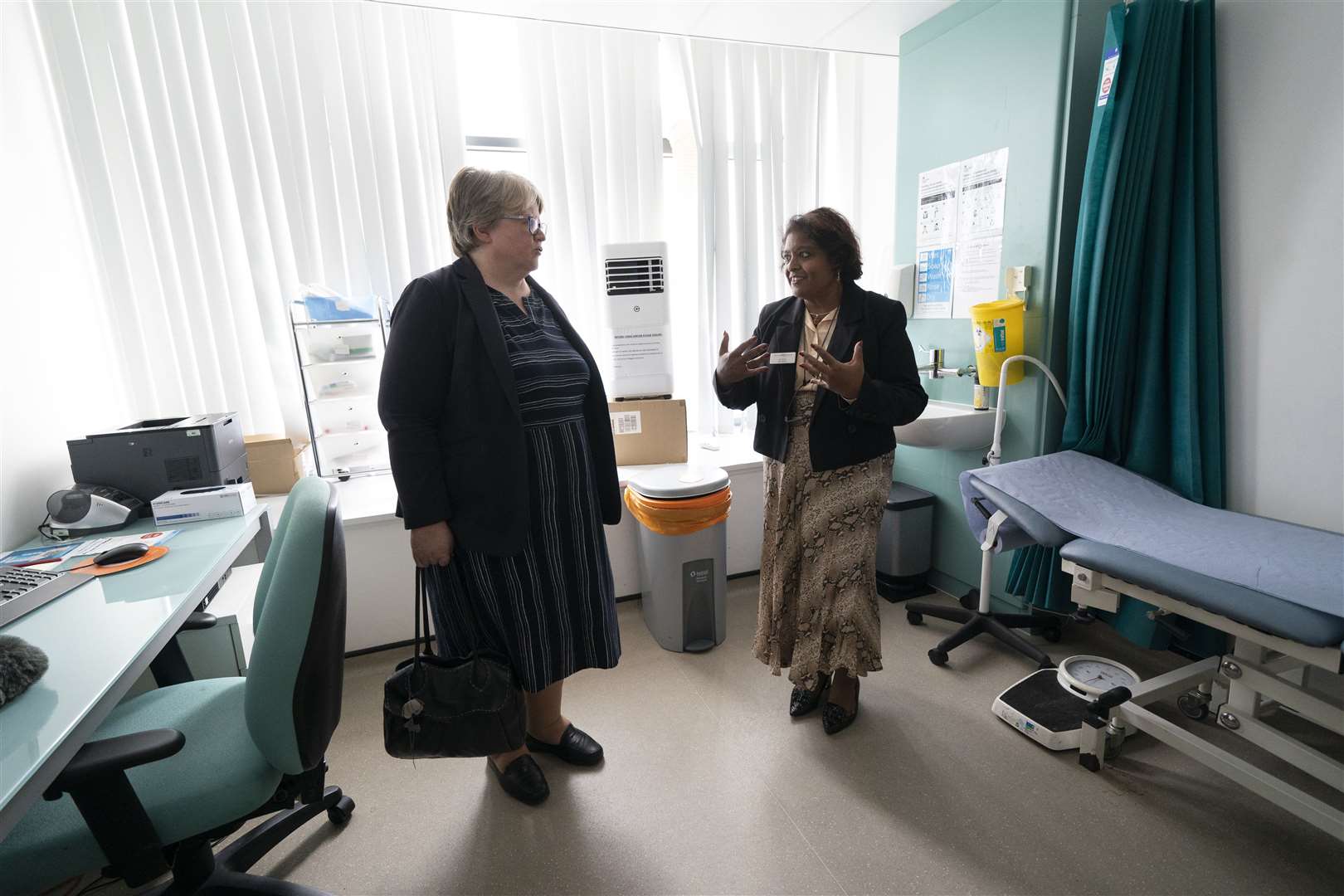 Therese Coffey (left) speaks to Dr Sheila Neogi during her visit to The Marven Surgery in London (Kirsty O’Connor/PA)