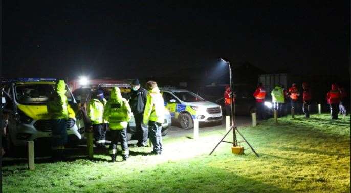 A large number of police vehicles and personnel are taking part in the search. Picture: UKNiP