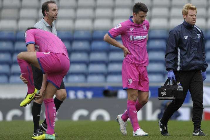 Chris Whelpdale goes off injured against Oldham Athletic Picture: Barry Goodwin