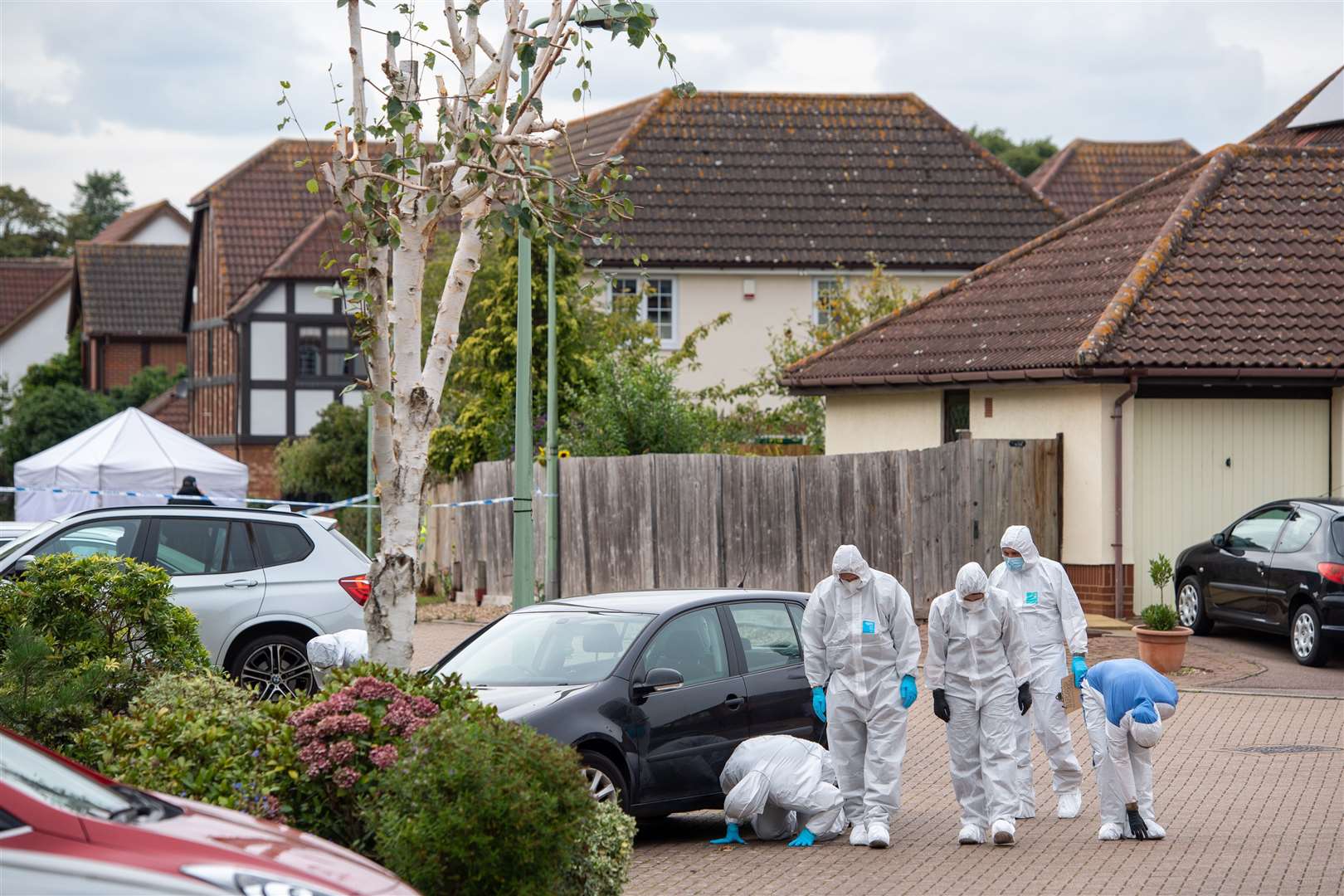 Police officers conducting a search in Kesgrave, Suffolk, following the shooting of a boy who was walking to school. (Joe Giddens/ PA)