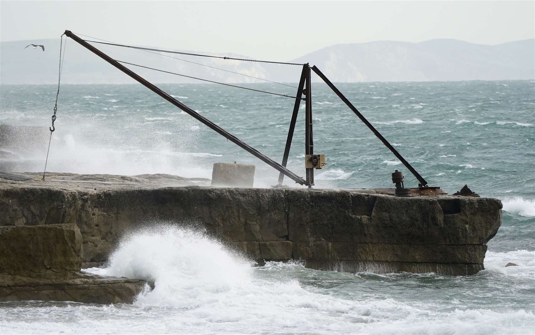 Waves crash against the shoreline at Portland Bill in Dorset (Andrew Matthews/PA)