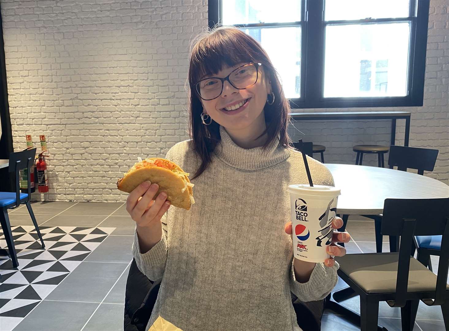 Reporter Cara Simmonds enjoys a beef taco at the new store