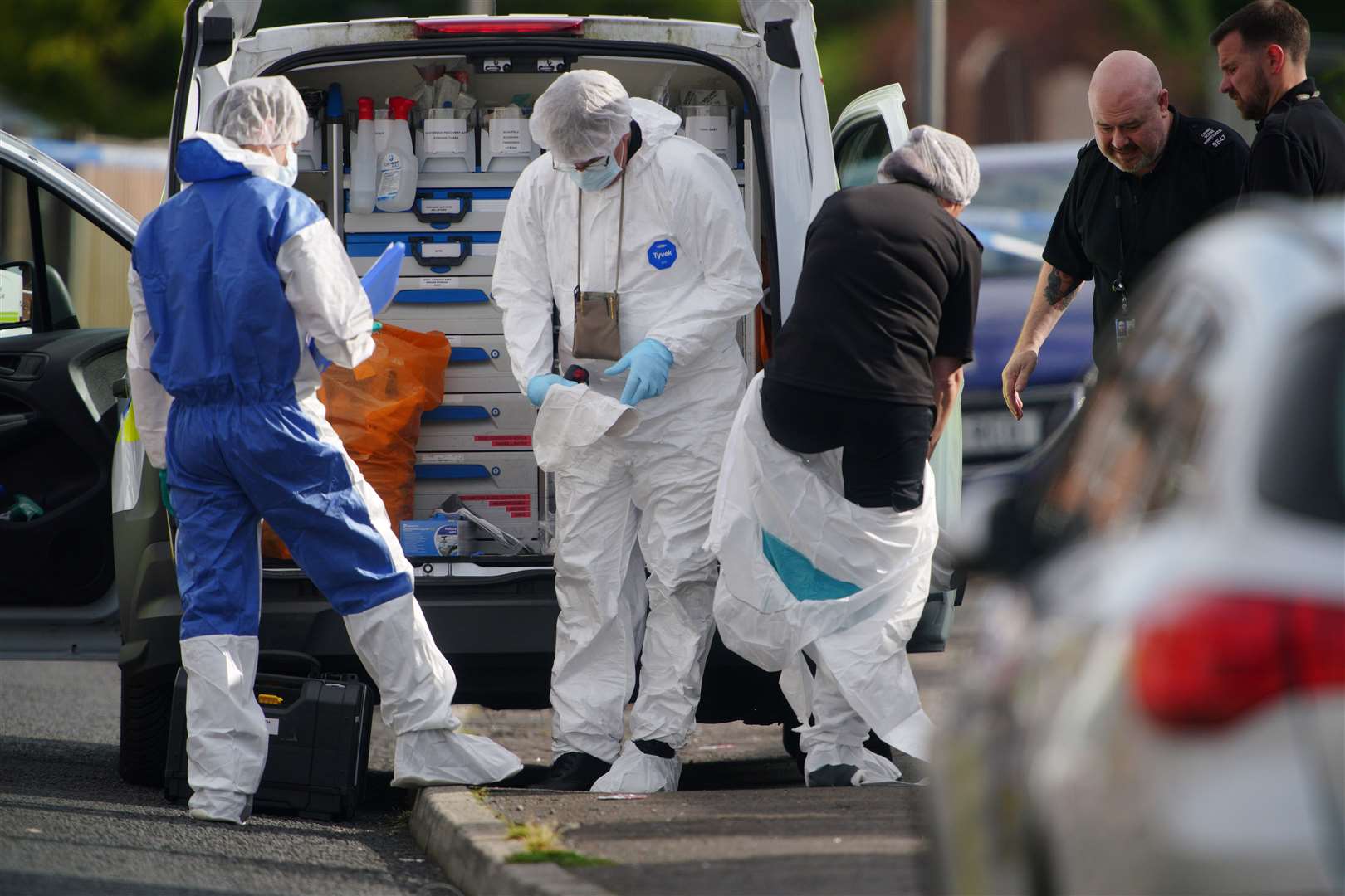 Forensic officers near to the scene in Kingsheath Avenue, Knotty Ash, Liverpool (Peter Byrne/PA)