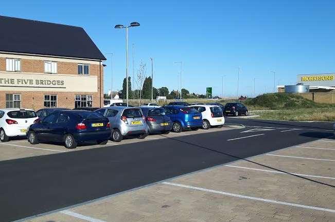 The new retail terraces will go between the Five Bridges pub and the back of Morrisons at Neats Court