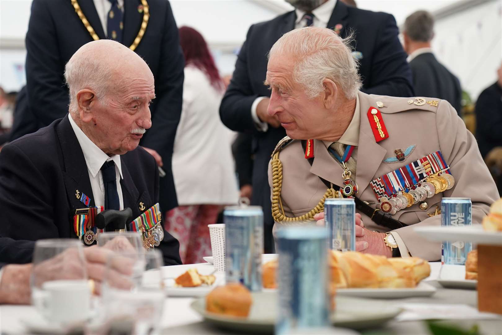 The King speaks to D-Day veteran Arnie Salter, 98, from Warwickshire, during a lunch following the commemorative event in Normandy (Gareth Fuller/PA)