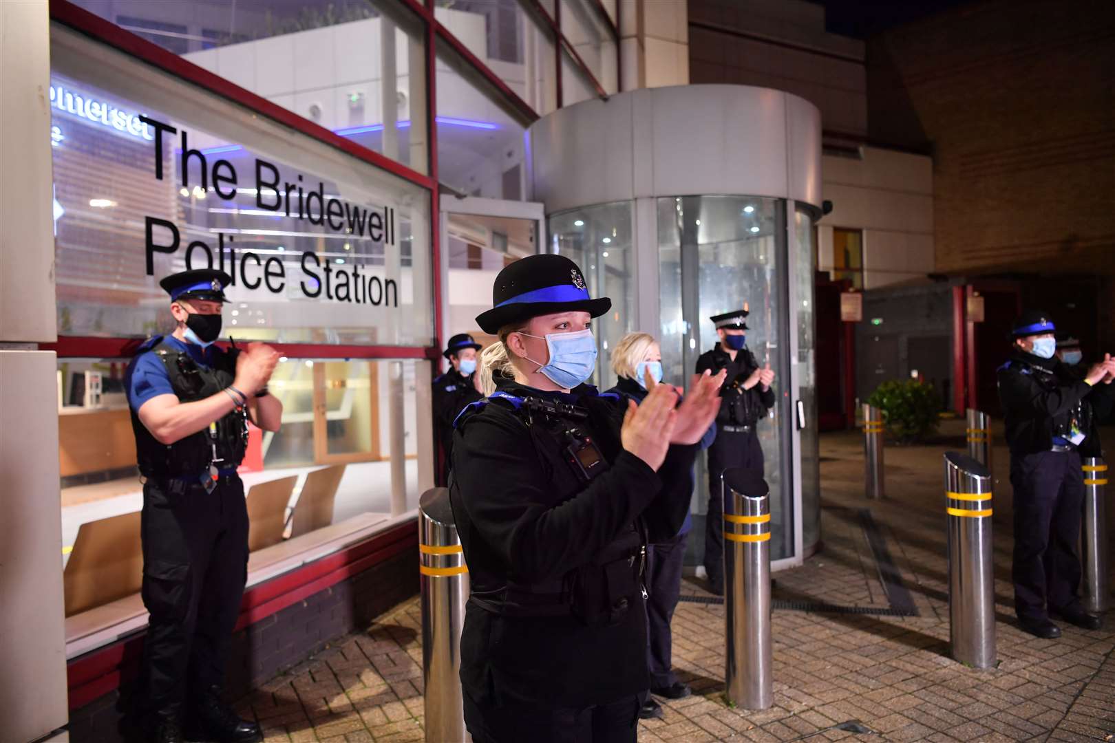 Officers paid their respects outside Bridewell police station in Bristol city centre (Ben Birchall/PA)