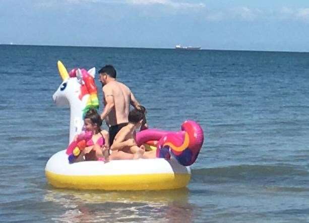 They were riding an inflatable unicorn when they got into difficulty and started to get swept out to sea. Picture: RNLI (14803228)