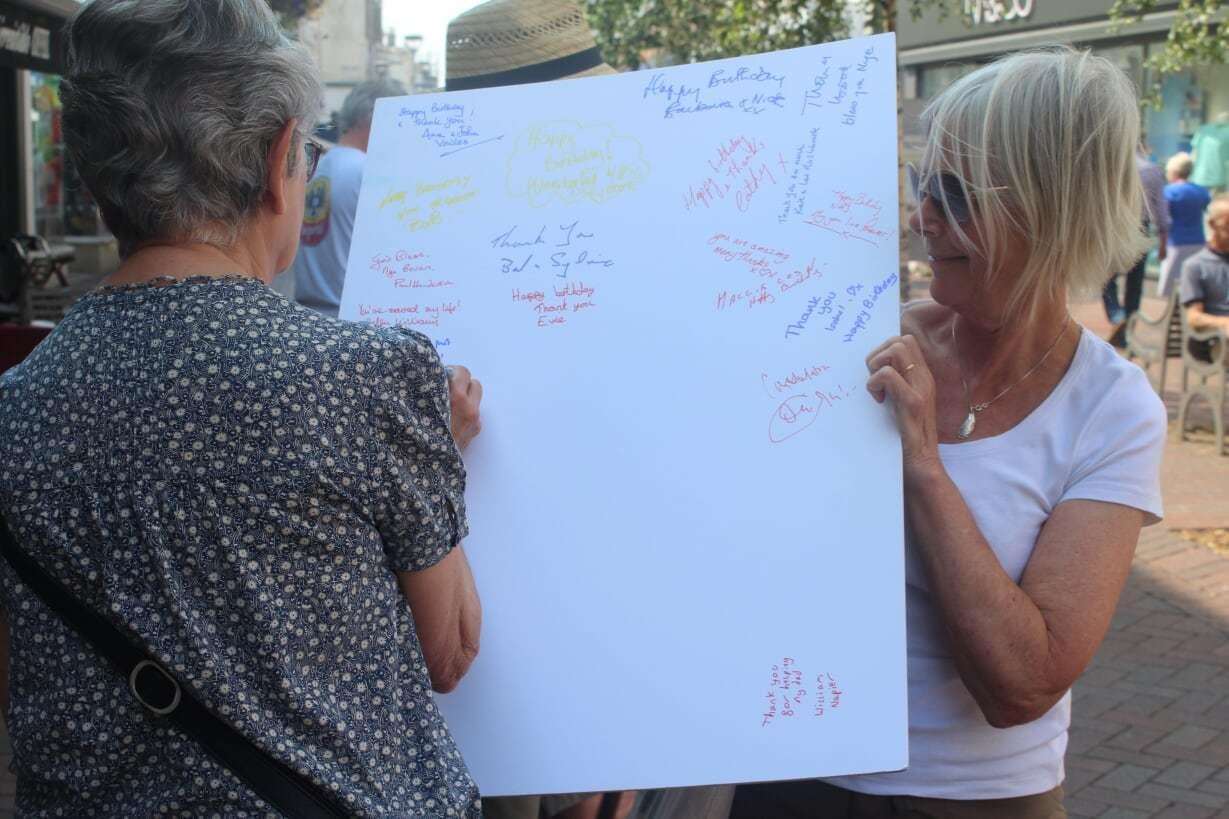 Locals signing the NHS card in Deal. Picture: Dover and Deal Labour Party