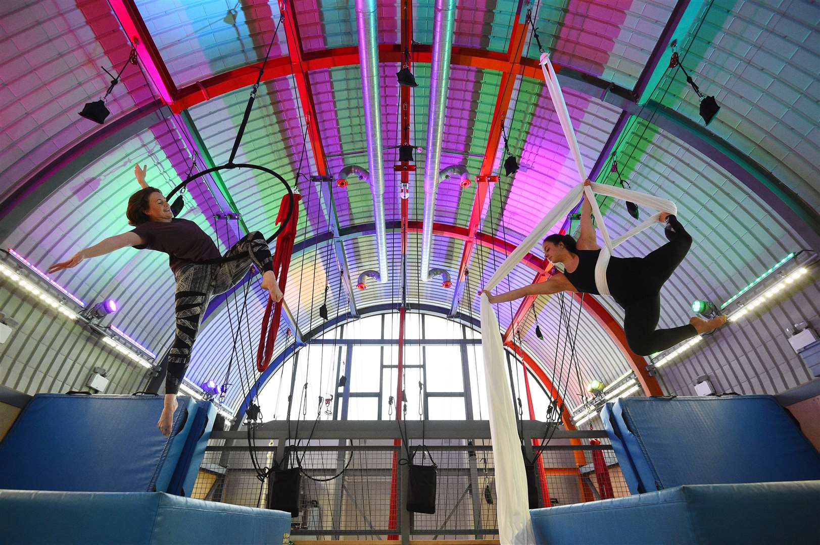 Aerialists Ruby Wain (right) and Catherine Ryan practice their skills on ribbons and hoops at Flying Fantastic in Southwark, London (Kirsty O’Connor/PA)