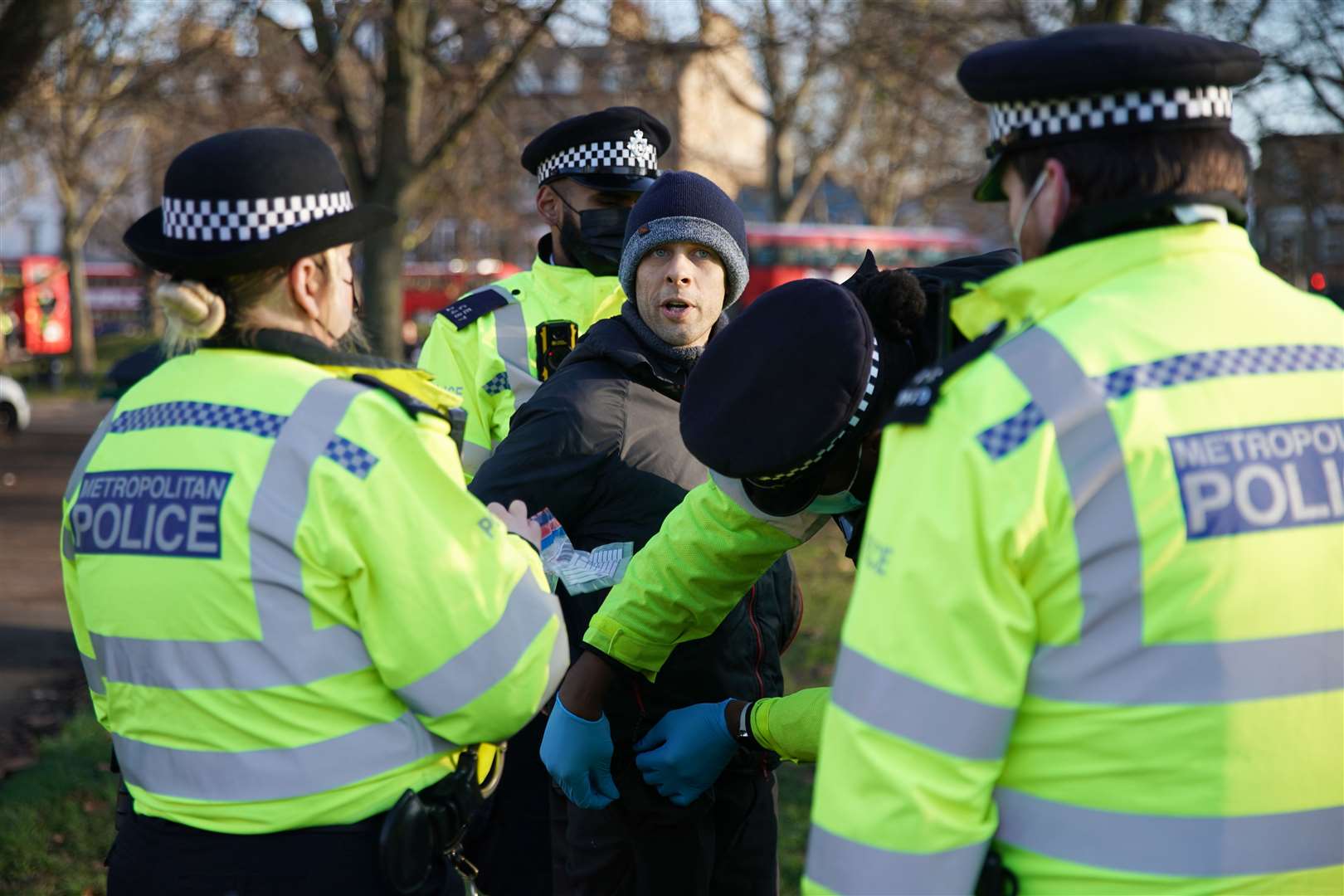 Police detain a man during an anti-lockdown protest in Clapham Common, south London, on Saturday (Aaron Chown/PA)