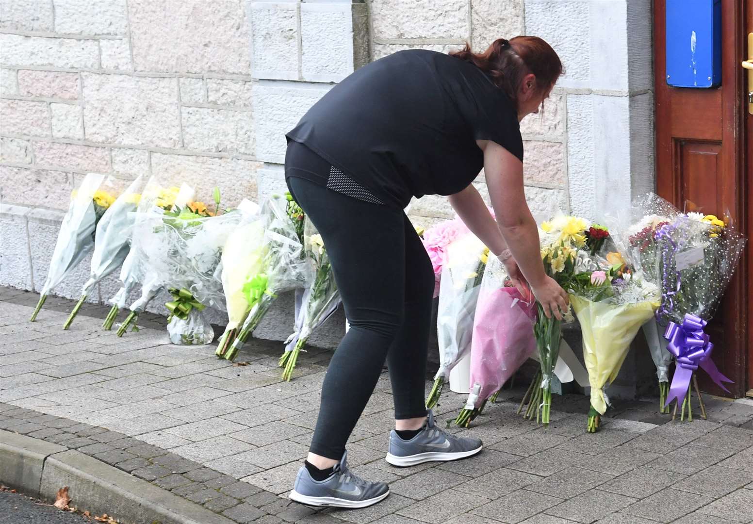 Floral tributes outside Ballaghaderreen garda station (Michael McCormack/PA)