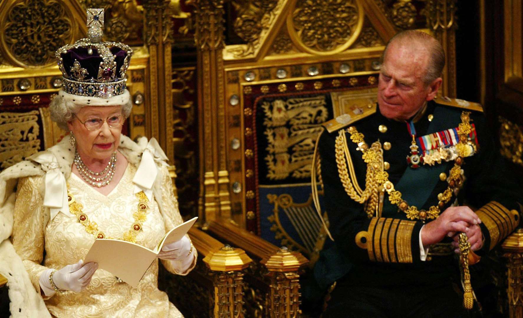 The duke watched the Queen read her speech from his consort’s throne in 2002 (PA)