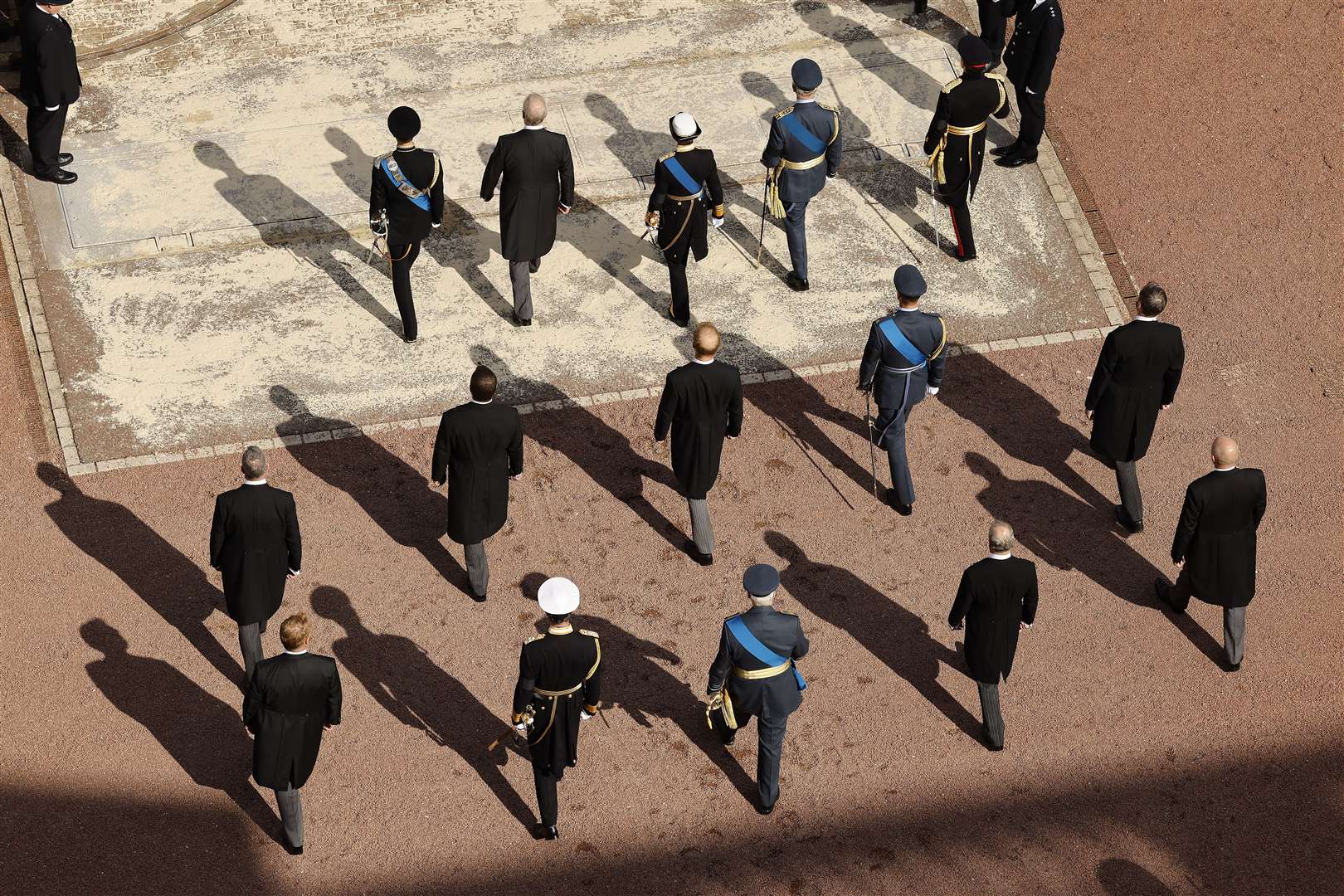 Members of the royal family follow the coffin of Queen Elizabeth II, draped in the Royal Standard with the Imperial State Crown placed on top, as it is carried on a horse-drawn gun carriage of the King’s Troop Royal Horse Artillery (Chip Somodevilla/PA)