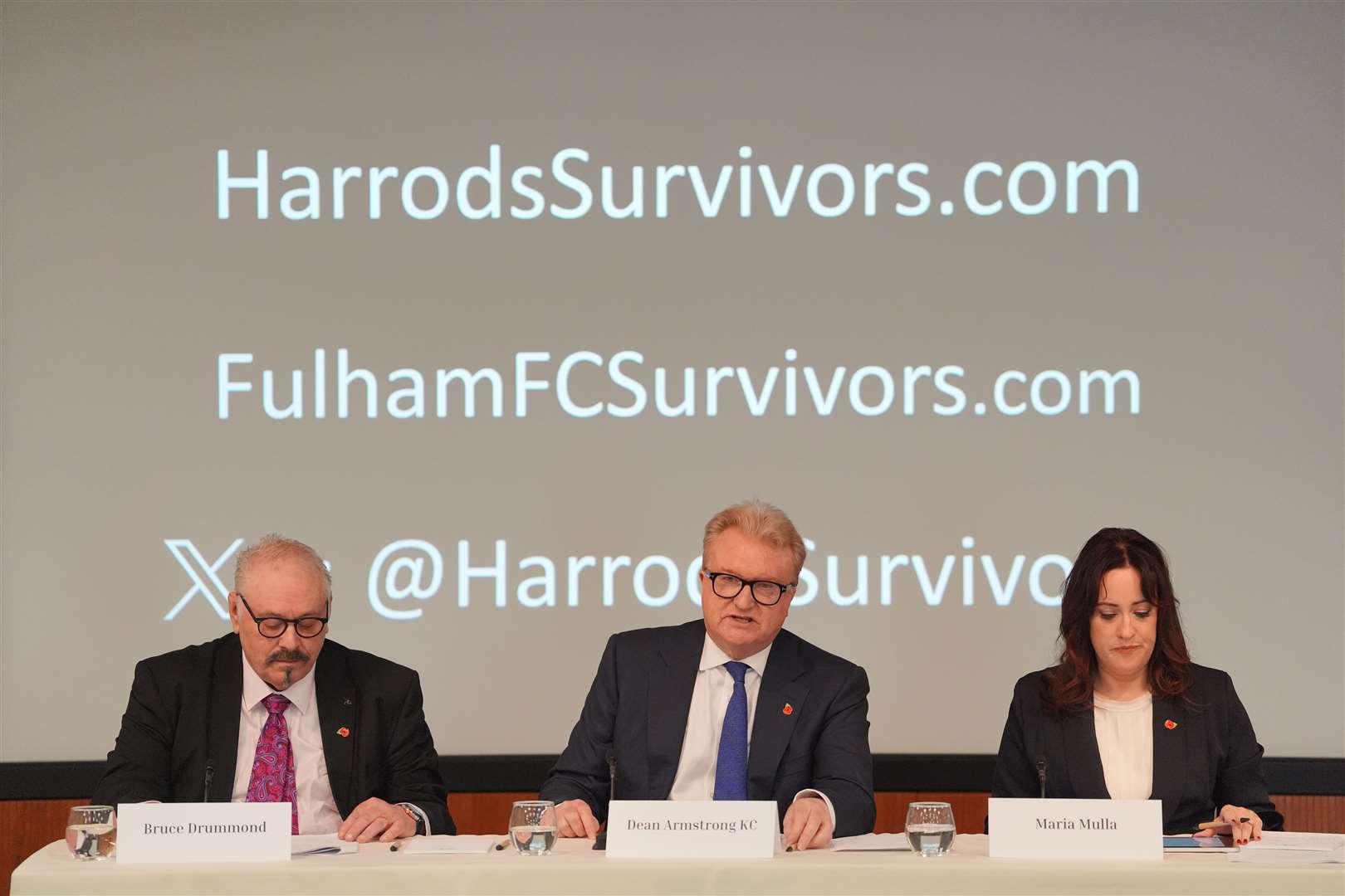 Bruce Drummond, Dean Armstrong KC and Maria Mulla, who are representing the Harrods Survivors group speak during a press conference on Thursday (Jonathan Brady/PA)