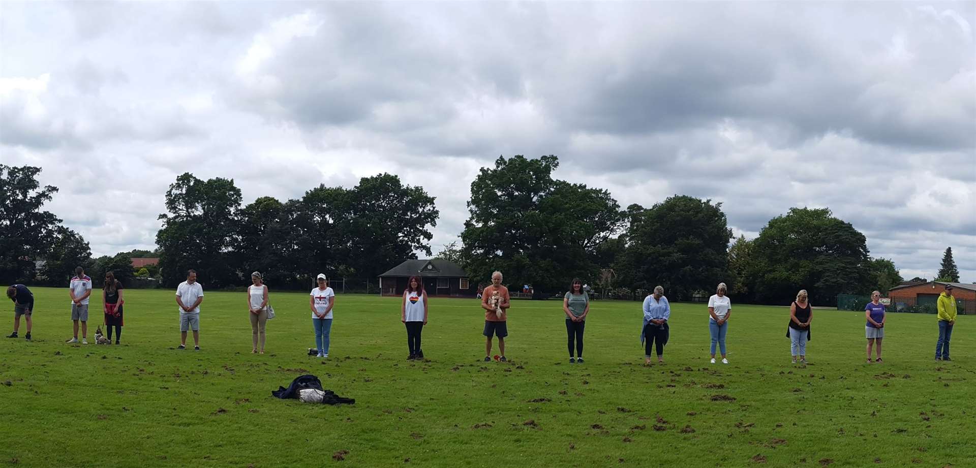 Paddock Wood cricketers stand in silent protest on the Memorial Field