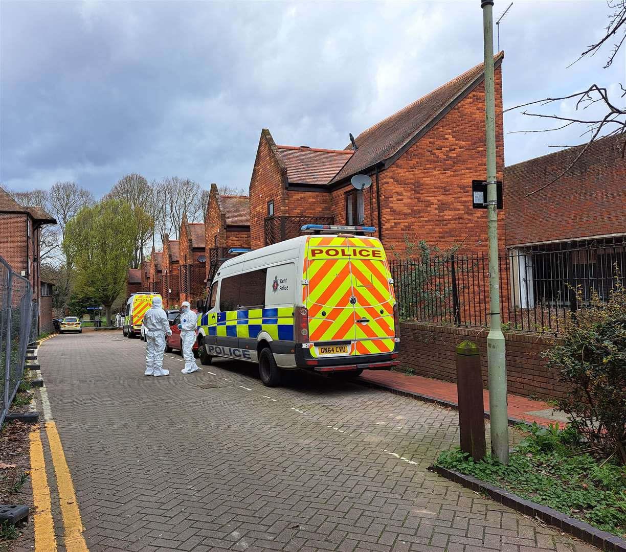 Paramedics on the scene after Guy Malbec was found dead in the Castle Street car park in Canterbury.