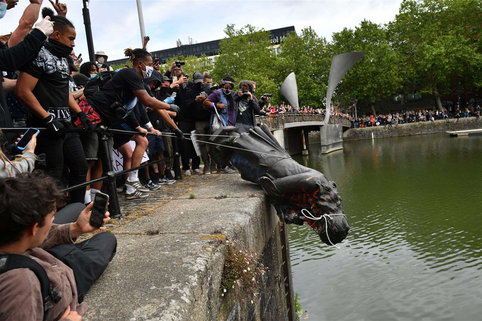 Protesters throw a statue of Edward Colston into Bristol harbour (Ben Birchall/PA)