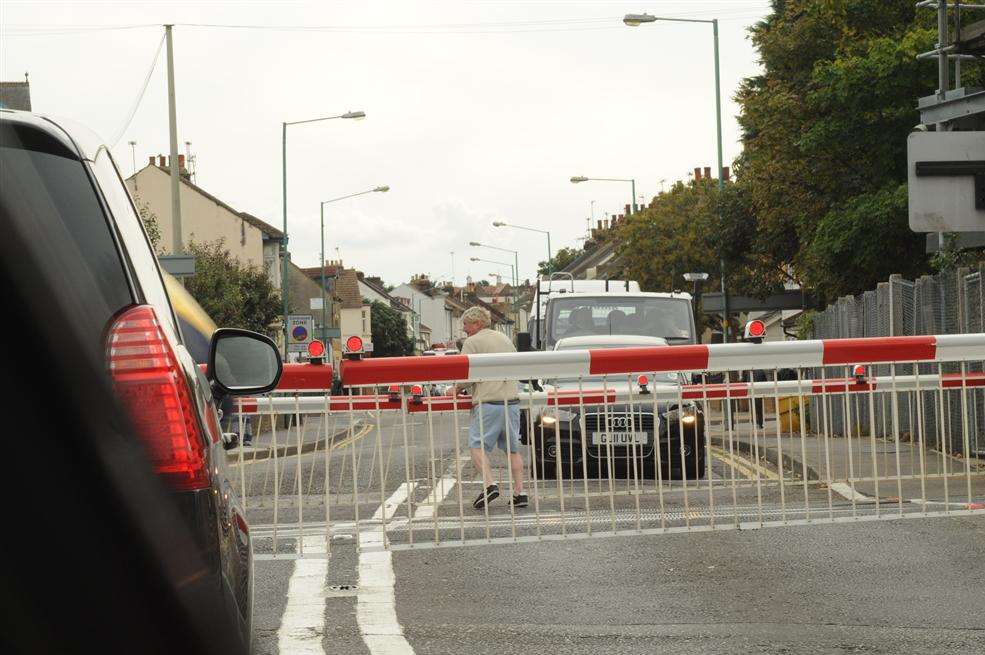 The man flees across the railway track at Gillingham railway crossing.