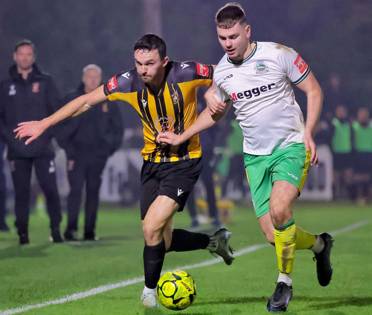 Folkestone forward Dan Smith battles for the ball - prior to his sending-off - with Dover defender Luca Cocoracchio. Picture: Helen Cooper