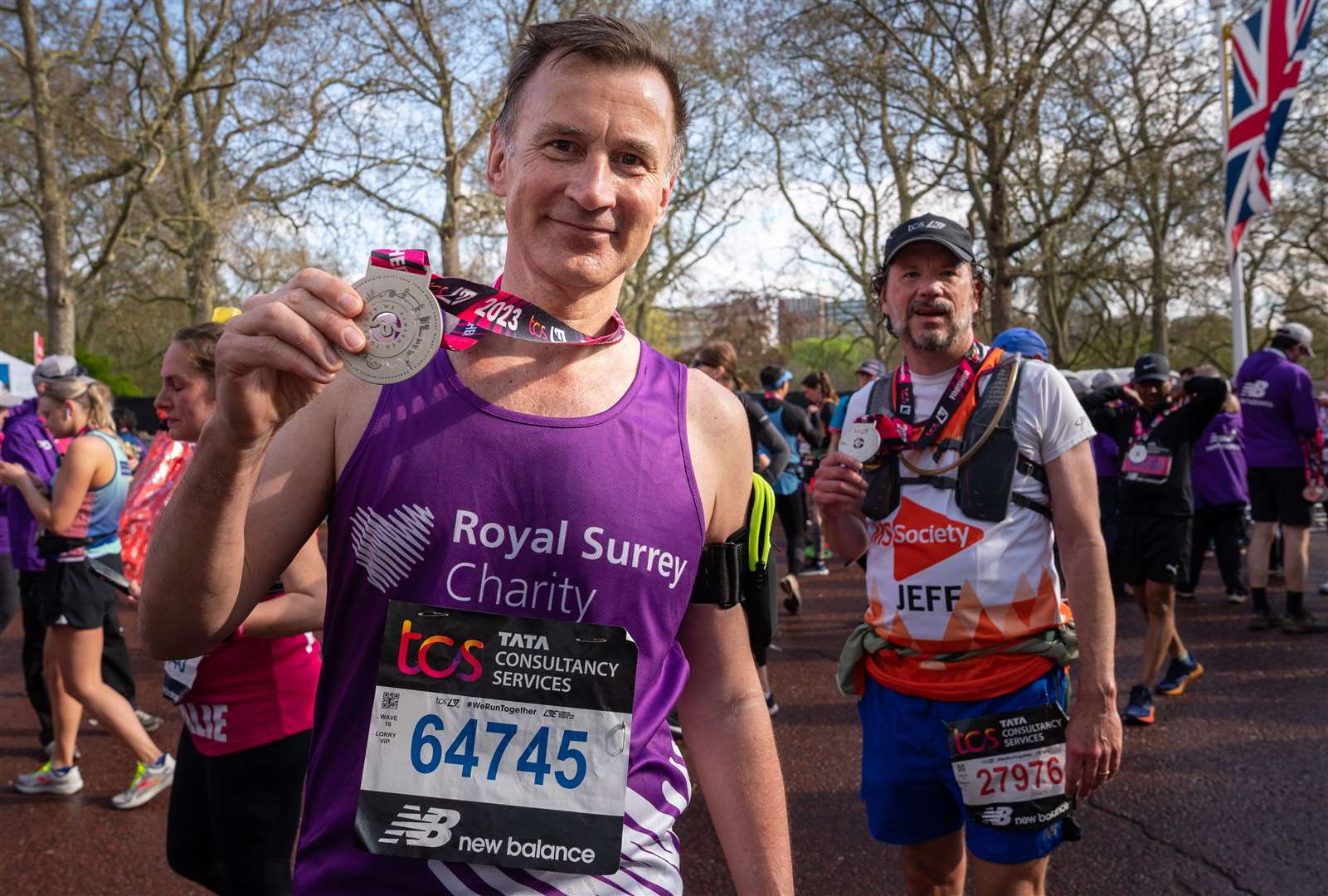 Jeremy Hunt holding his medal in the finish area after completing the London Marathon in aid of cancer charities (PA)