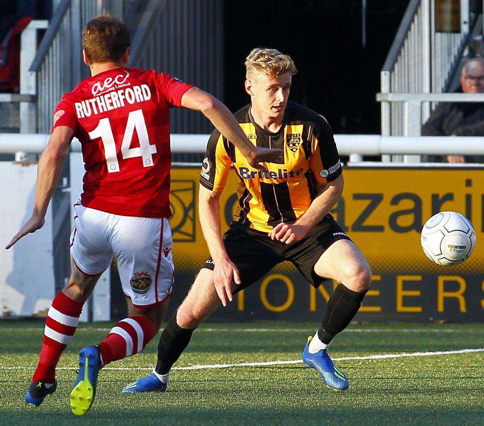 Maidstone's George McLennan in the heat of battle Picture: Sean Aidan