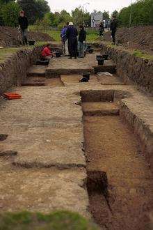 Archaeologists working on the site. They have found Roman murder victim and some other items.