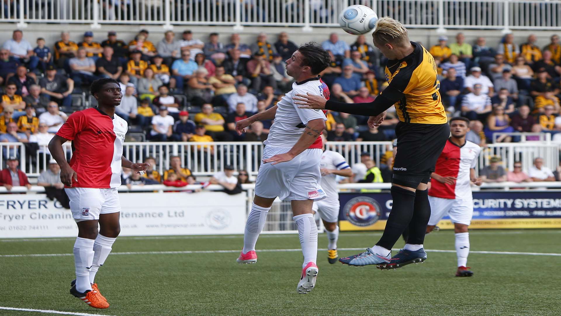 Maidstone's Joe Pigott wins a header against Woking. Picture: Andy Jones