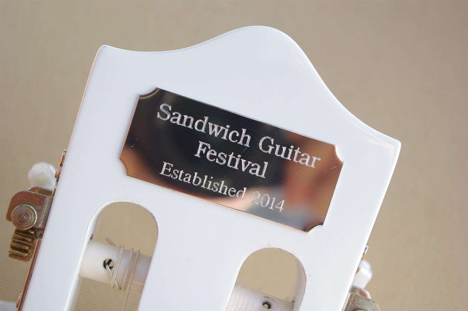 Guitarists and audiences can sign the guitar for a donation